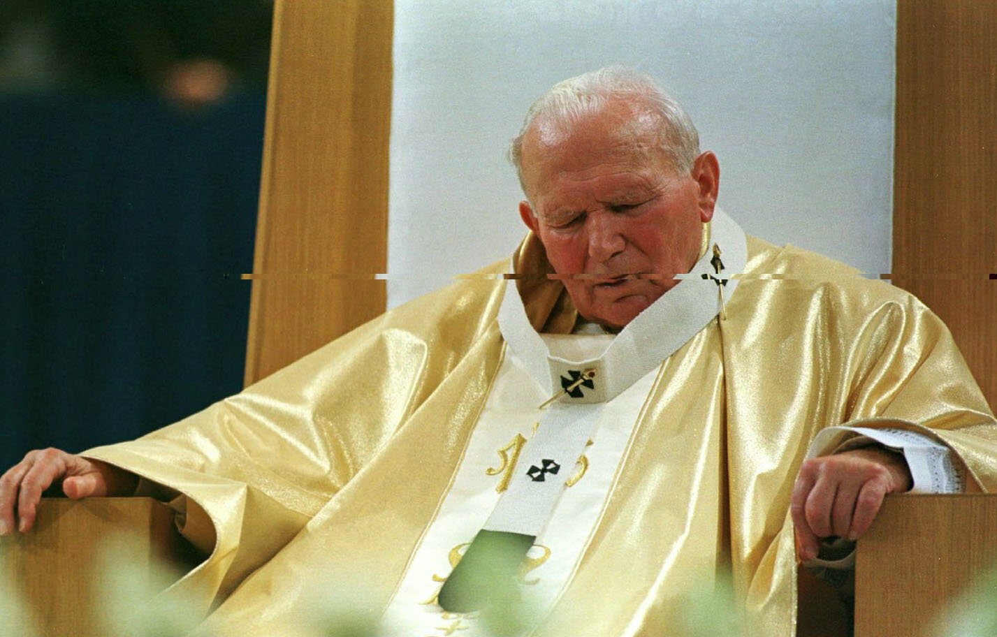 Pope John Paul II sits during Mass at the Trans World Dome in St. Louis Jan 27, 1999.